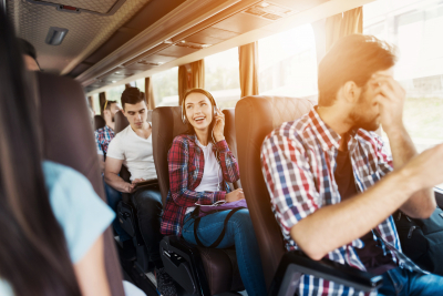 people in a charter bus for their group tour